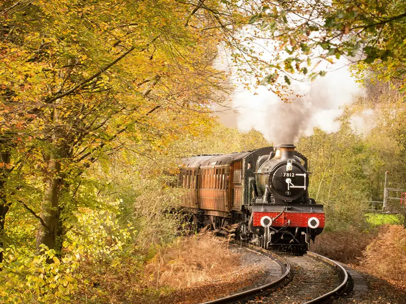 A steam train on the Severn Valley Railway in autumn