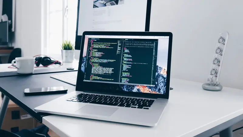 Website code being written on a laptop